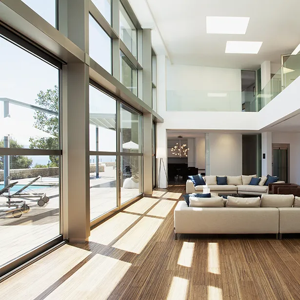 Direct sunlight is cascading on wooden floors, but Prestige Series residential window tinting can prevent fading.