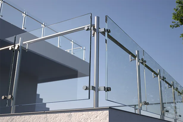 A glass banister is used on a commercial building, and 3M safety and security films can help minimize hazards should it spontaneously break.